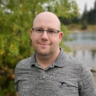 A person wearing glasses and a grey shirt

Description automatically generated with low confidence